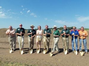 Precision Tank & Equipment Co. (PT&E) officials gathered for a groundbreaking ceremony on August 28, 2013 in Humboldt, IA.  Pictured from left are: Charlie Chemento, Brandt Co.; Mike Zeitler, PT&E VP of Operations; Ron Lager, PT&E National Sales Manager; Alissa Reinholdt, Humboldt County EDC Director; David Hemming, PT&E President & CEO; Glen Brandt, Founder of Brandt Co.; Gary Ruff, PT&E Regional Sales Manager; Walter Jensen, City of Humboldt Mayor; Joel Armitage, Sande Construction VP.
