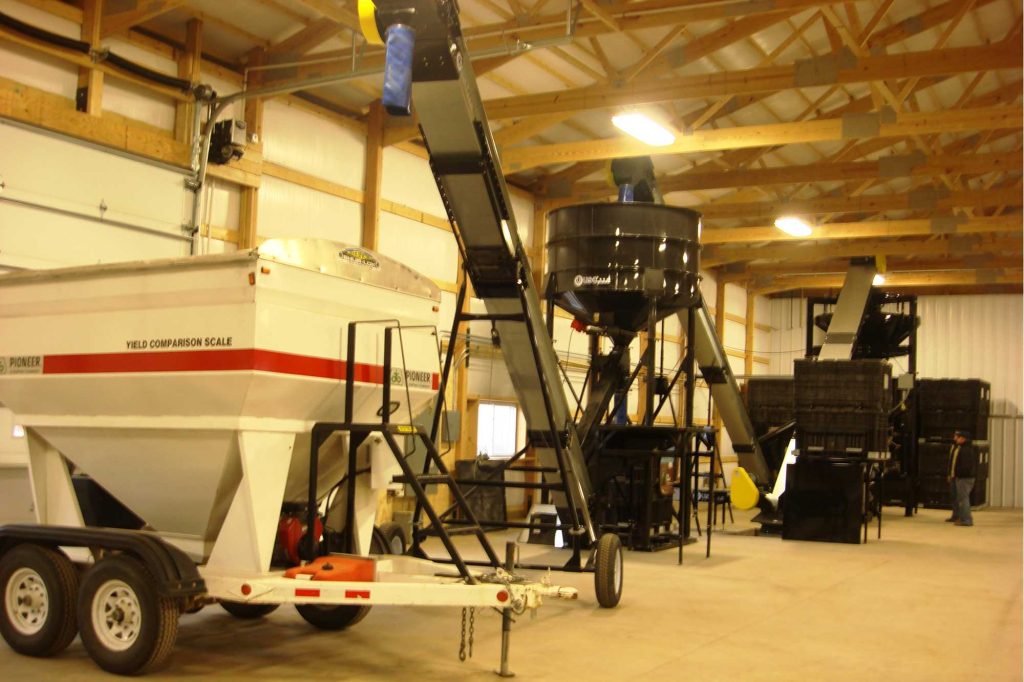 Showing the drive-thru layout, tenders, semis and other trailer options can easily load treated seed inside.