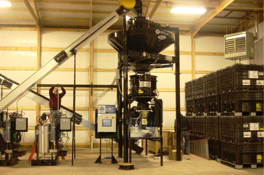 USC’s installation crew putting the final touches on Gumz Seed Service’s site. Front view of the LPX2000 treater, Tri-Flo® and single panel automation.