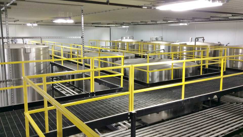 A pipe rack with walkwaystairs allows the operator to easily access the chemical tanks and keeps all the piping up and out of the way