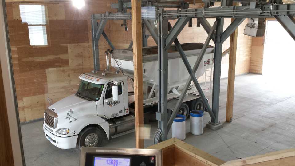 Dry fertilizer will be loaded onto this tender truck.