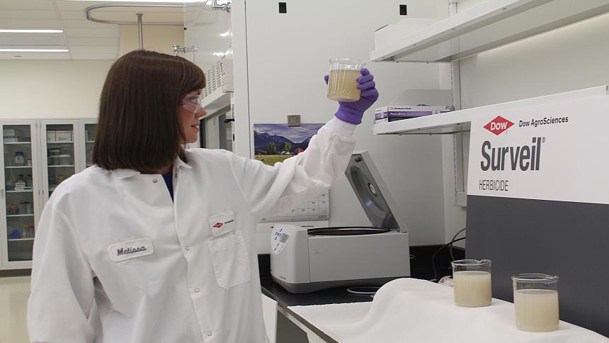 Melissa Olds, formulation chemist for Dow AgroSciences, demonstrates the handling properties of Surveil herbicide.  