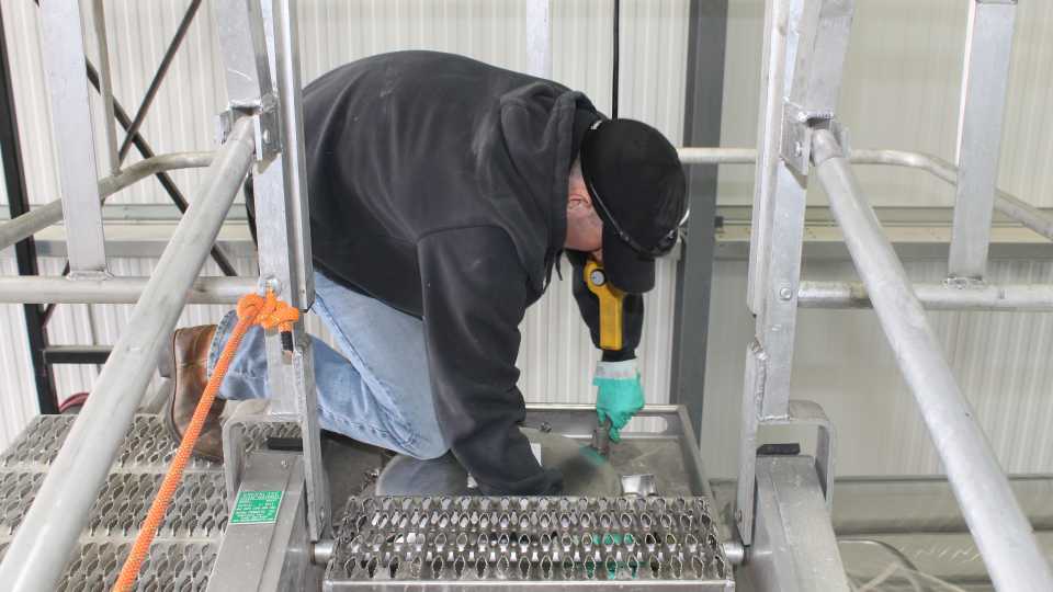 Sealing top hatch at Asmus Farm Supply