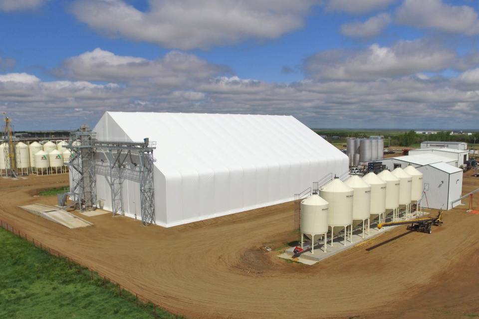 Greystone Construction built the tension membrane fertilizer storage building (left) and steel seed treater building (right)